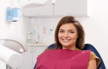 Dental Patient Sitting in Dentist Chair Smiling Atlanta, GA